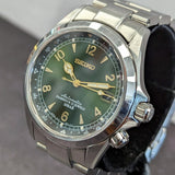 Close-up of SARB017 sunburst green dial and gold-tone hour markers