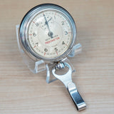 Vintage NEW HEAVEN 100 Miles Pedometer - Silver tone round case w/holder