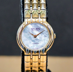 Gruen Watch with Interchangeable Color Bezels and Mother of Pearl dial. GRUEN, Quartz, Mother of Pearl Dial, CZ Bezel Blue Leather  main image 4